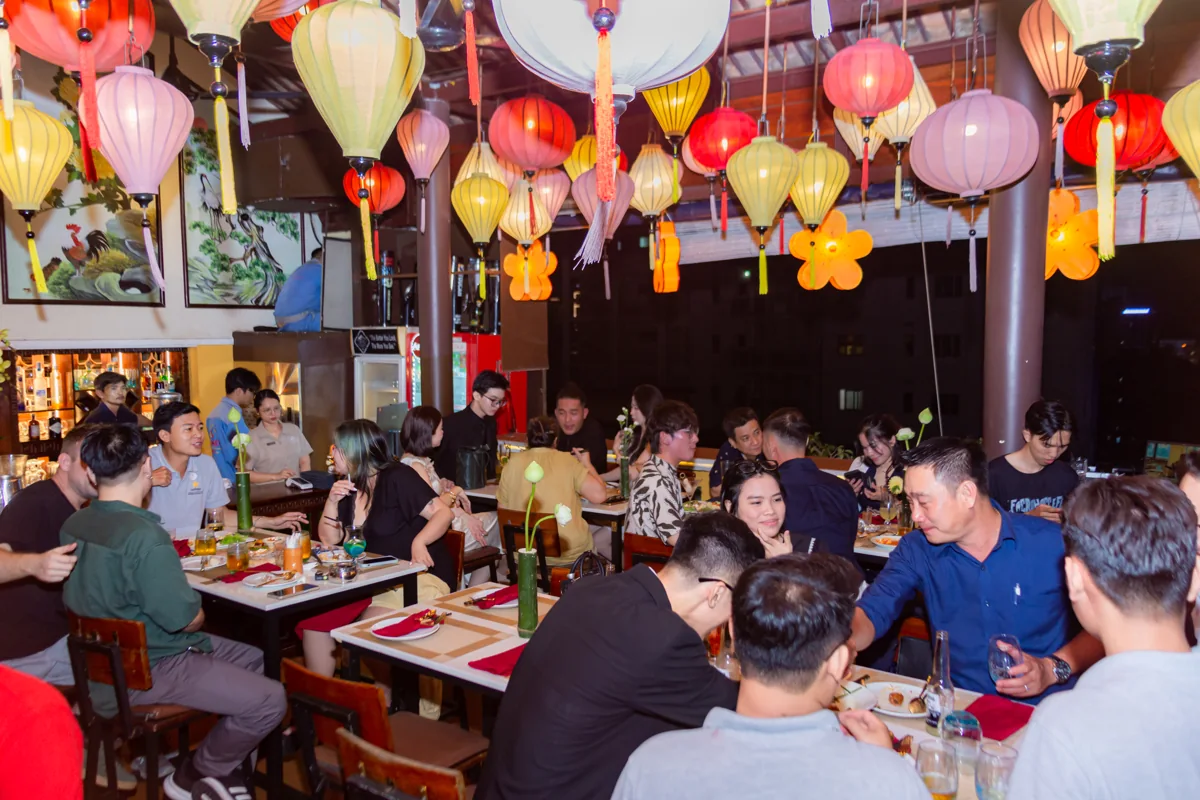 Guests dine beneath colorful lanterns at The View Rooftop Bar, 195 Bui Vien