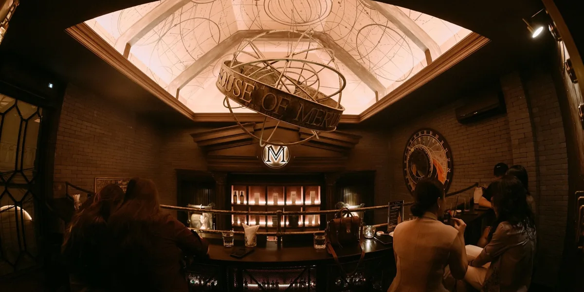 Panoramic interior of House of Merlin at 178/1 Pasteur, with its illuminated ceiling and steampunk bar.