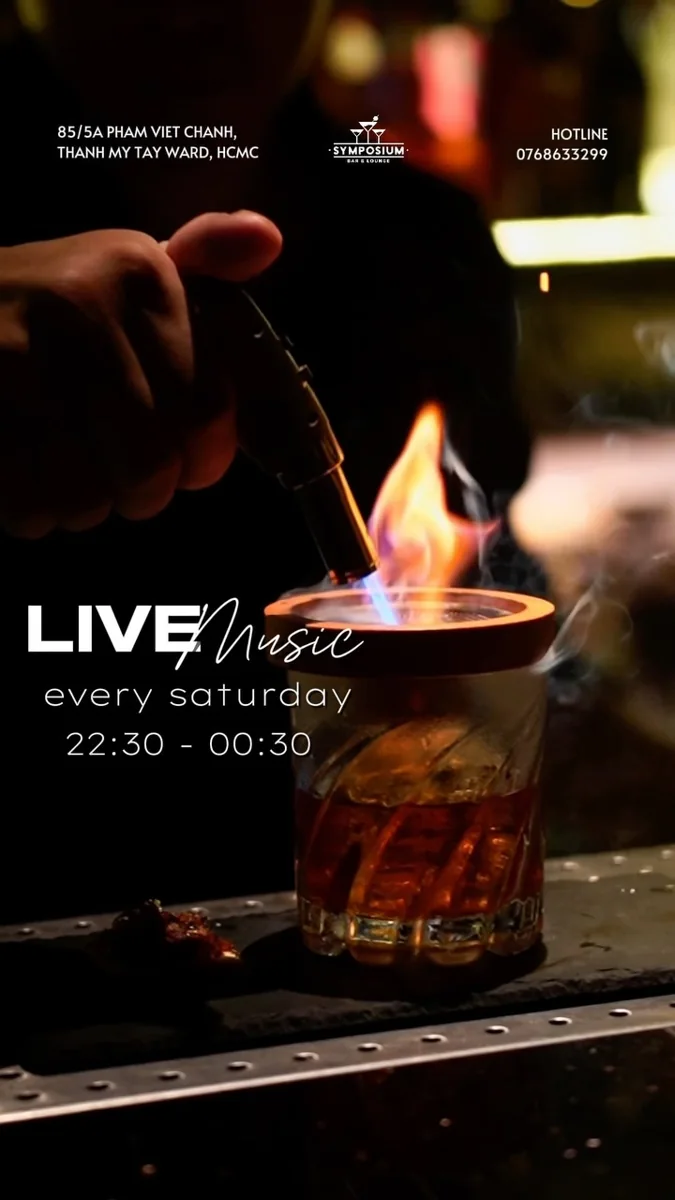 Symposium Bar live music every Saturday poster showing 22:30–00:30 and the Pham Viet Chanh address.
