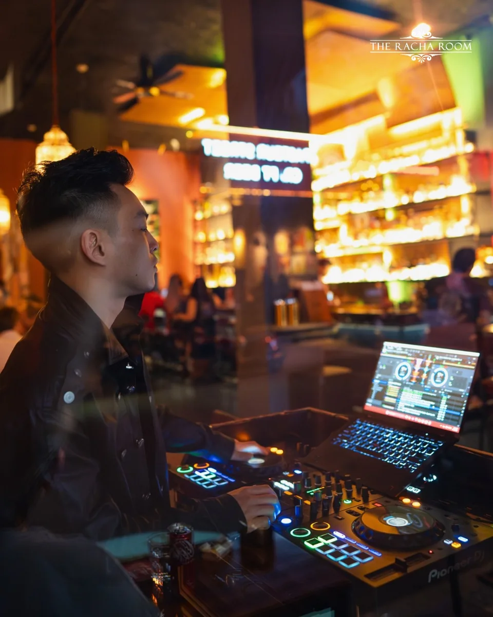The Racha Room DJ at the decks in the venue; undated promotional photograph.