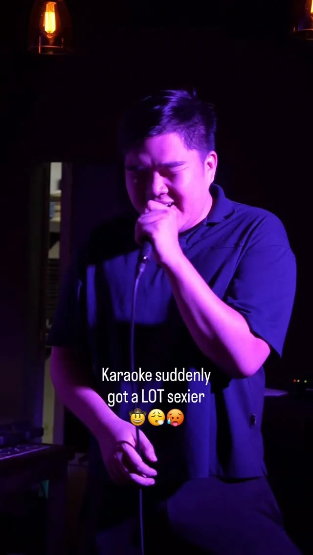 Singer holding a microphone in an Alibi karaoke reel thumbnail.