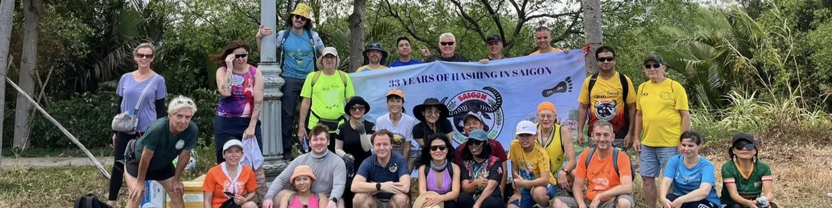 Saigon Hash House Harriers group photo with banner