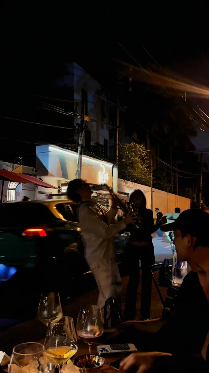 Saxophonist performing outside Wine Not? Thao Dien, from its Friday saxophone announcement.