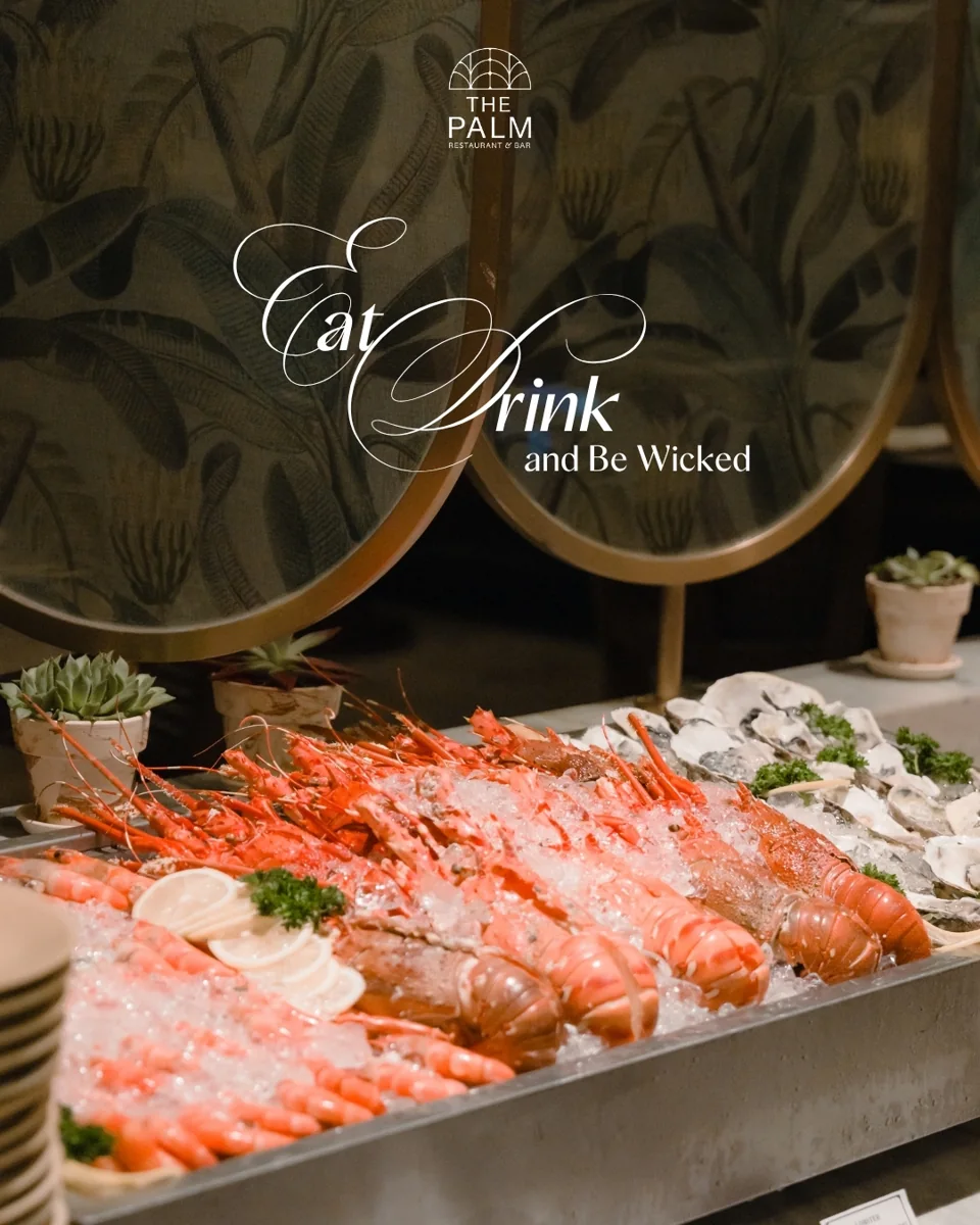 The Palm Halloween buffet image with Eat, Drink and Be Wicked lettering and seafood spread.