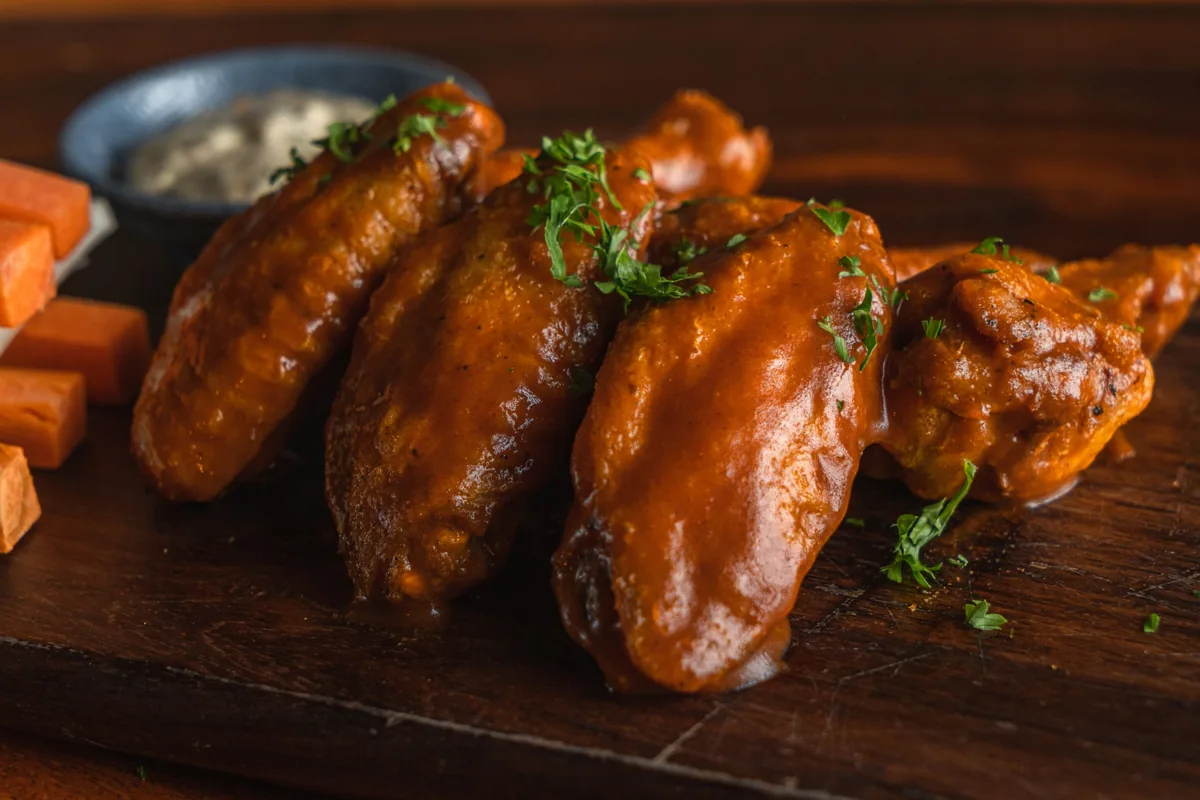 Malt Saigon chicken wings pictured in its Wing Wednesday promotion; 50 percent off every Wednesday.