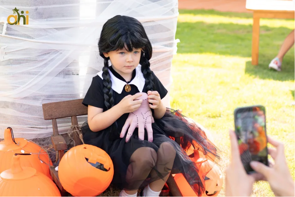 Child in a Halloween costume at an earlier Anne Hill Halloween Bazaar; illustrative photo for the 2026 event across three campuses.