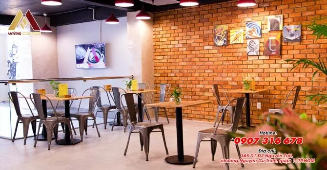 Date-neutral interior of Mars Coffee at 385 D1–D2 Nguyễn Trãi, District 1, showing its café tables and seating; illustrative venue photo for the October 29 language exchange.