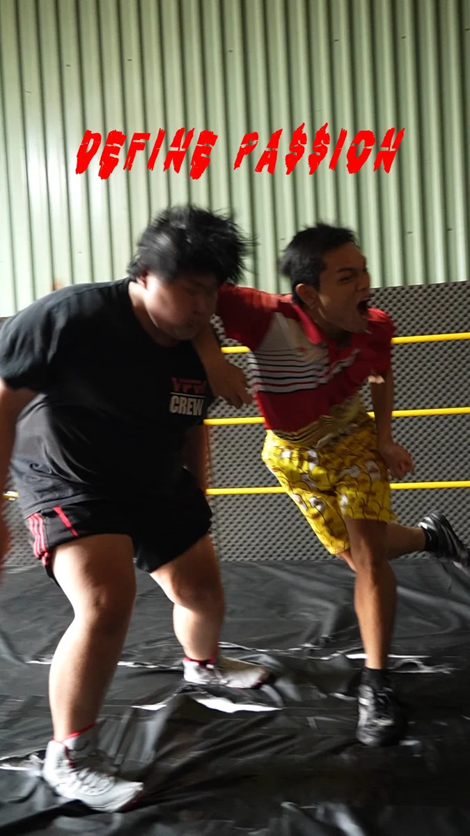 Two wrestlers practising in a ring at VAIB Studio for VPW Academy free beginner trial classes (every Monday and Wednesday, 6:30-8 PM, District 7)