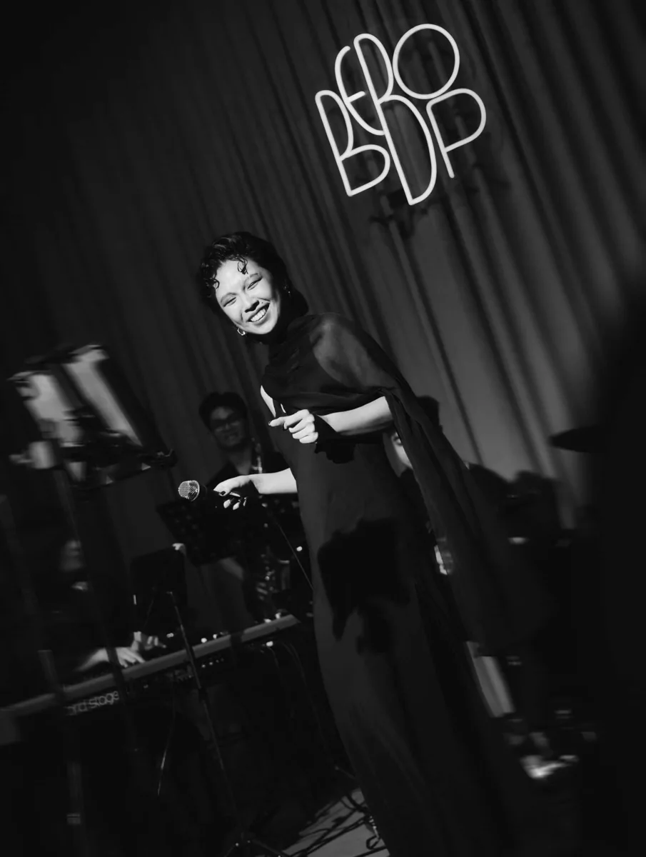 Bebop stage photo of a singer and band used with the Saturday jazz schedule post.